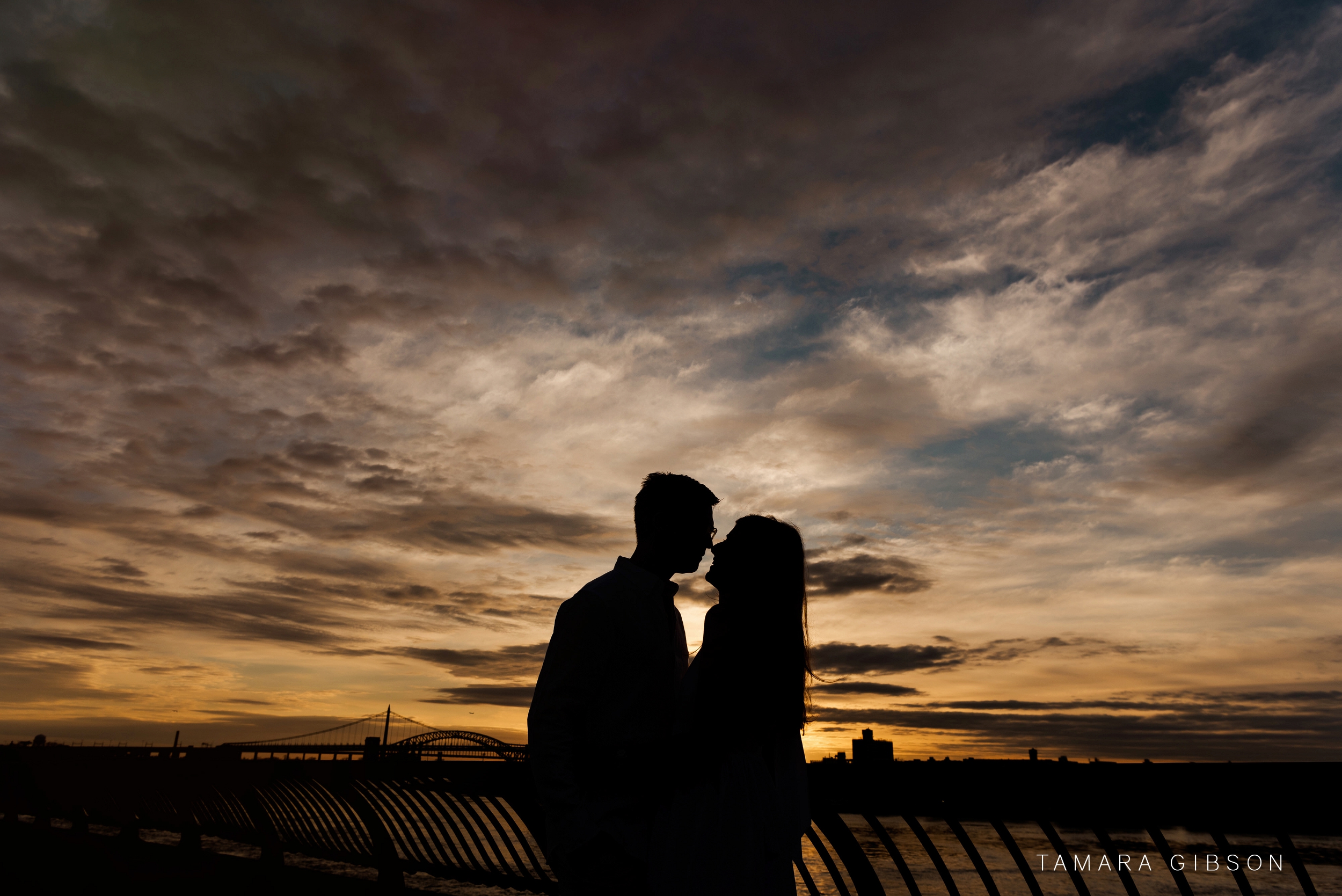 Photo of Silhouette of Couple against skyline at Carl Schurz Park Engagement Session 