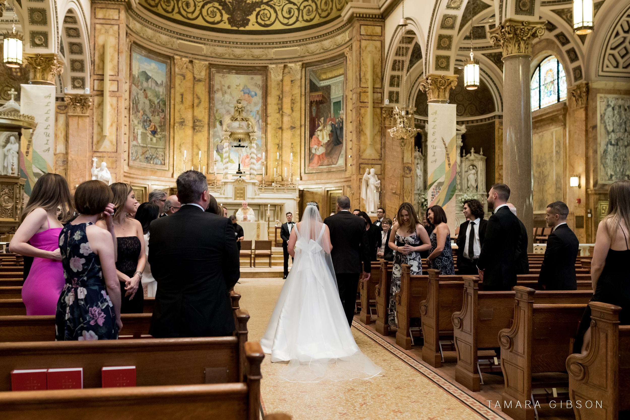 Father walking Victoria down the aisle during NYC Wedding at St. Ignatius of Loyola Church