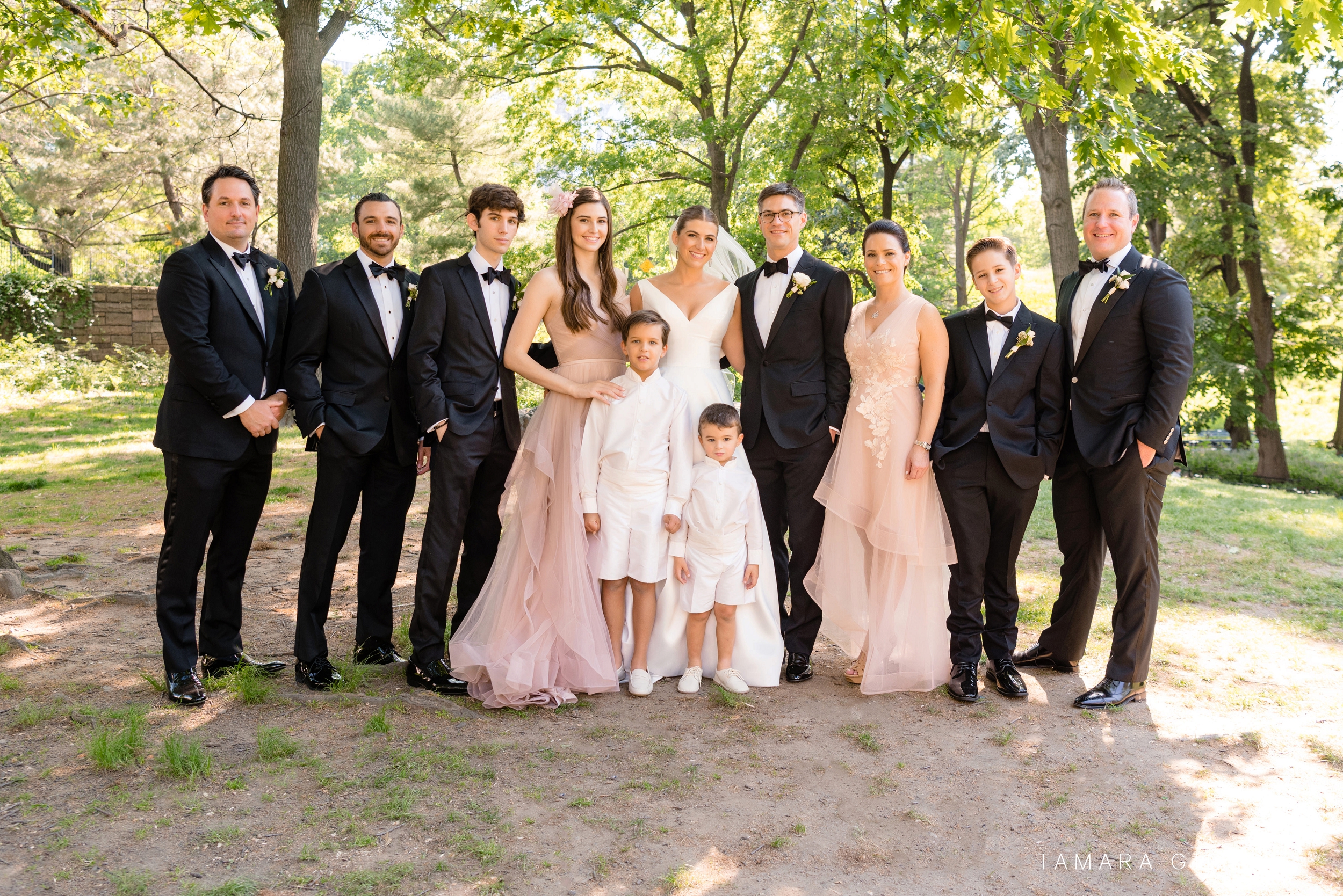 Bridal party under trees