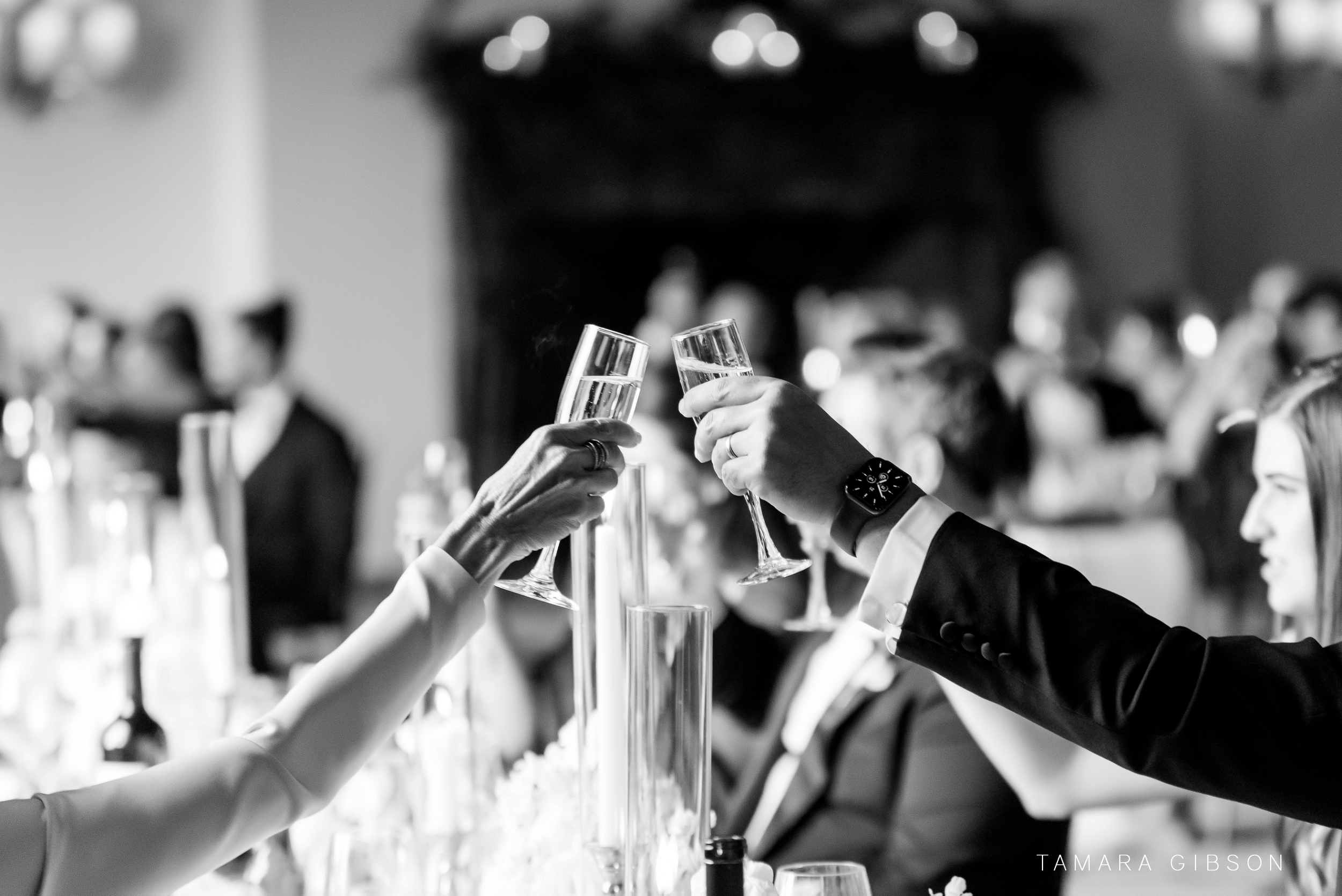 Detail of Glasses toasting at NYC Wedding