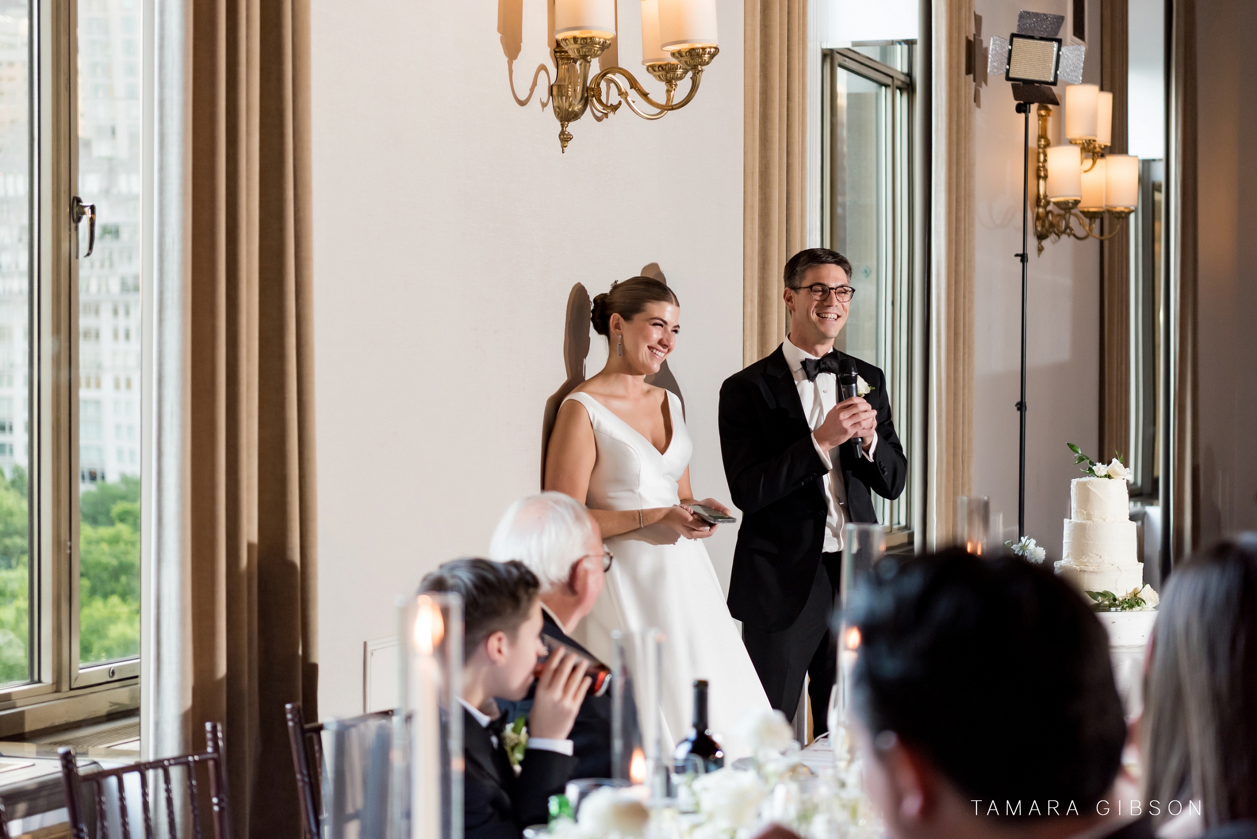 Victoria and Thomas during speech at New York Athletic Club during NYC Wedding